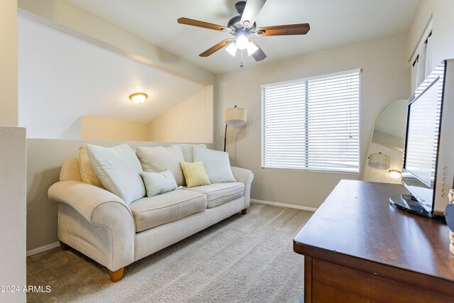 living room featuring ceiling fan, light carpet, and lofted ceiling with beams