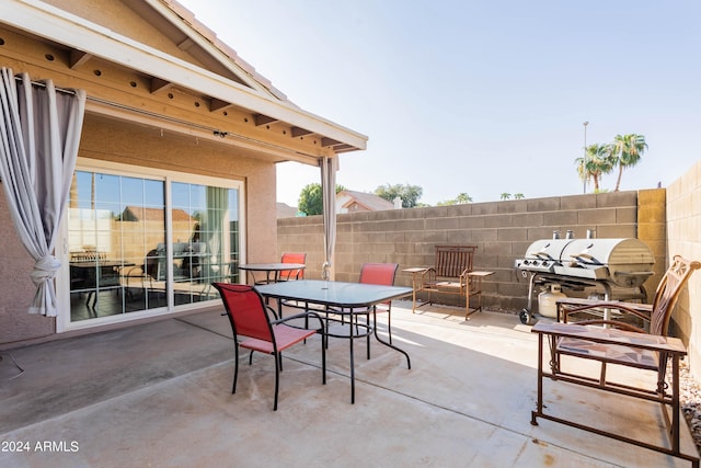 view of patio featuring a grill