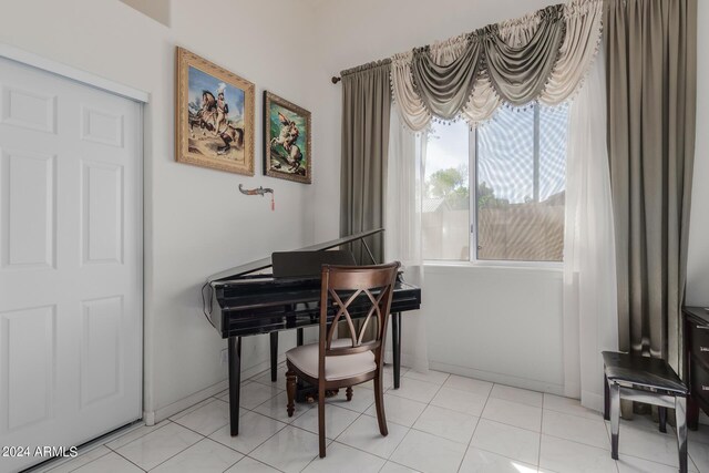 misc room with light tile patterned floors