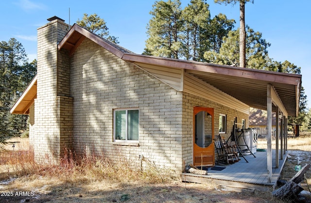 view of side of property featuring a deck