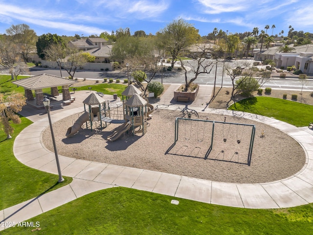 view of home's community featuring a gazebo, a residential view, playground community, and a yard