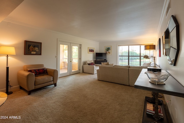 living room featuring plenty of natural light, french doors, and crown molding