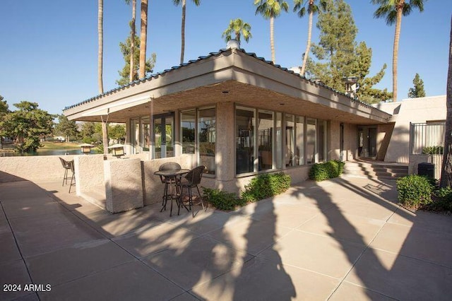 rear view of property with a patio