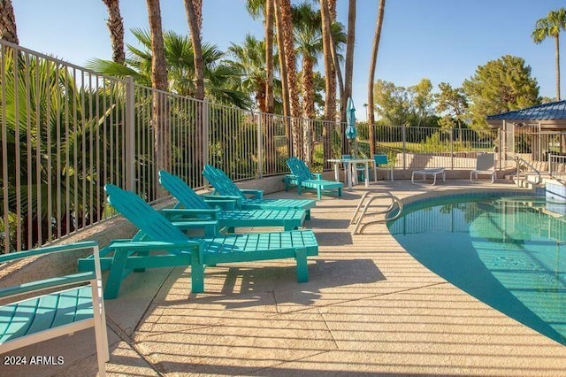 view of swimming pool featuring a patio area