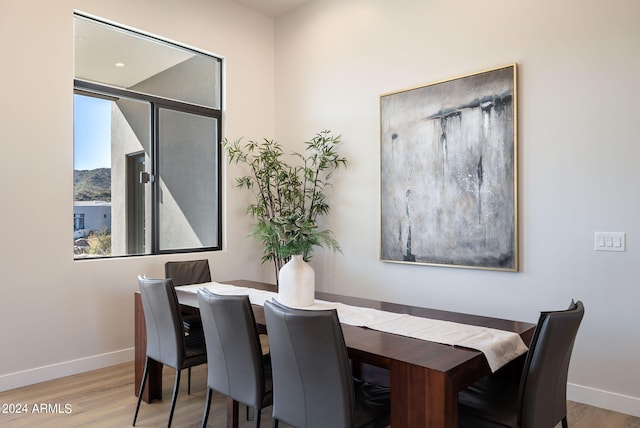 dining space with light wood-type flooring