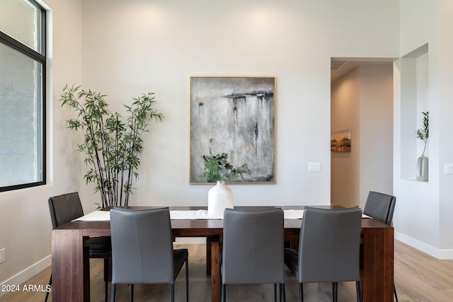 dining space featuring hardwood / wood-style floors