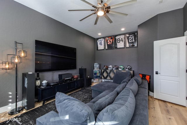 living room featuring ceiling fan and light wood-style flooring