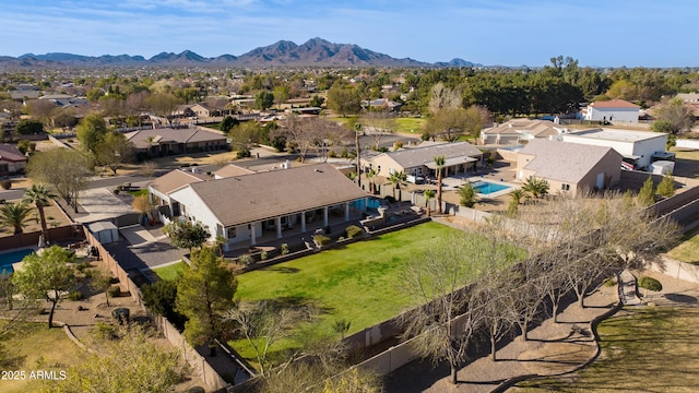 drone / aerial view featuring a residential view and a mountain view