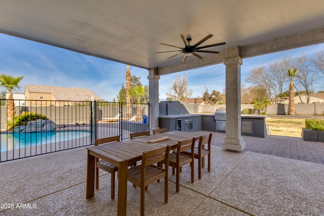 view of patio / terrace featuring outdoor dining area, a fenced backyard, a ceiling fan, exterior kitchen, and a fenced in pool