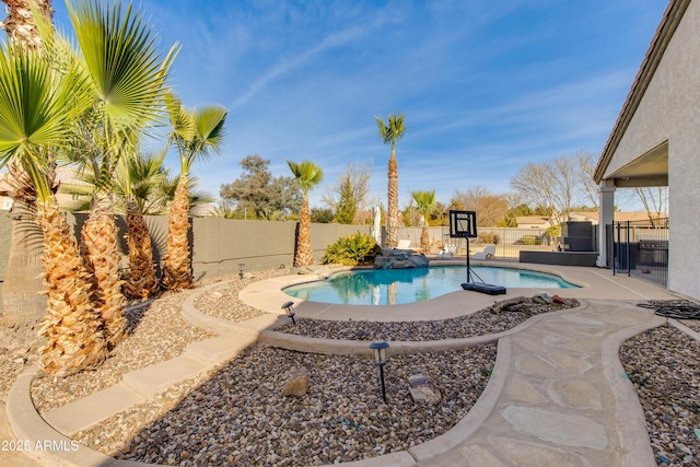 view of swimming pool with a patio, a fenced backyard, and a fenced in pool