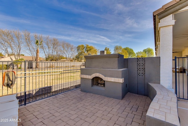 view of patio featuring a gate and fence