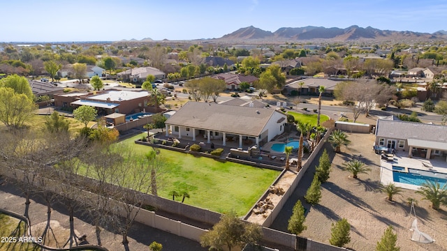 drone / aerial view featuring a residential view and a mountain view