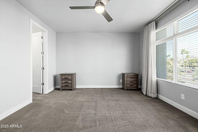 unfurnished room featuring light colored carpet and ceiling fan