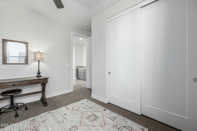 interior space featuring light carpet, a closet, and ceiling fan