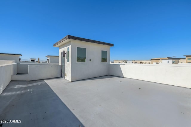 rear view of house featuring a patio area