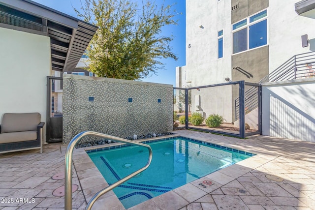 view of pool featuring a patio