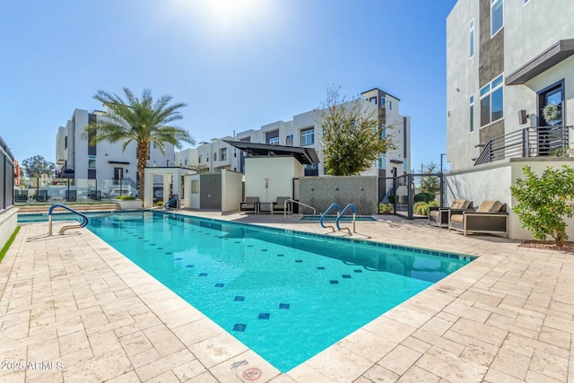 view of swimming pool featuring a patio