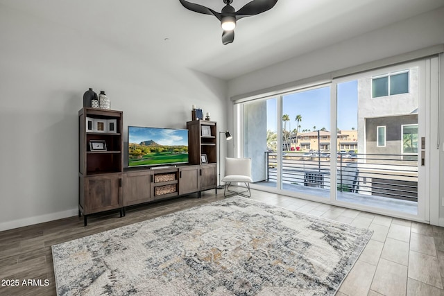 living room with ceiling fan and wood-type flooring