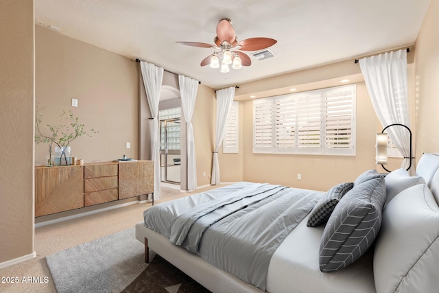 bedroom featuring visible vents, ceiling fan, baseboards, and carpet