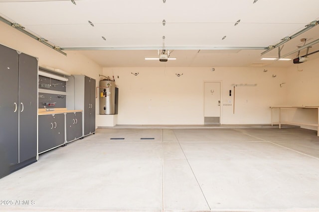 garage featuring a garage door opener and water heater