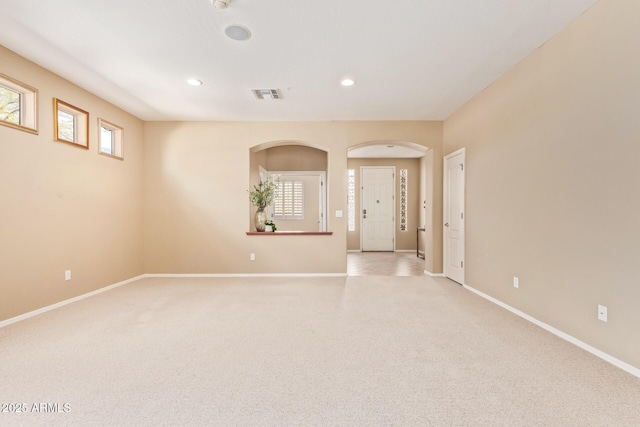 unfurnished room featuring recessed lighting, visible vents, baseboards, and light colored carpet