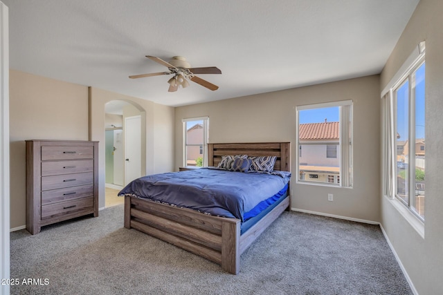 12720 W Cantenia Rd, Avondale, AZ 85392 - bedroom featuring carpet, multiple windows, arched walkways, and a ceiling fan