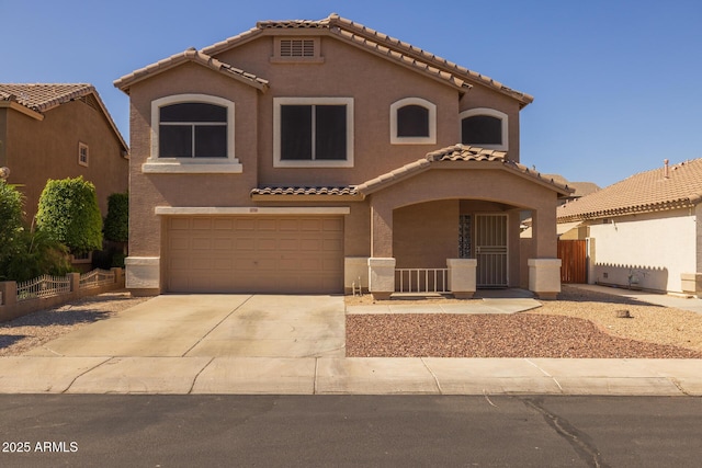 12720 W Cantenia Rd, Avondale, AZ 85392 - mediterranean / spanish home with stucco siding, a tile roof, an attached garage, and driveway