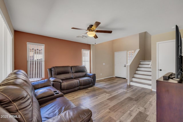 12720 W Cantenia Rd, Avondale, AZ 85392 - living area with ceiling fan, light wood-style floors, and stairway
