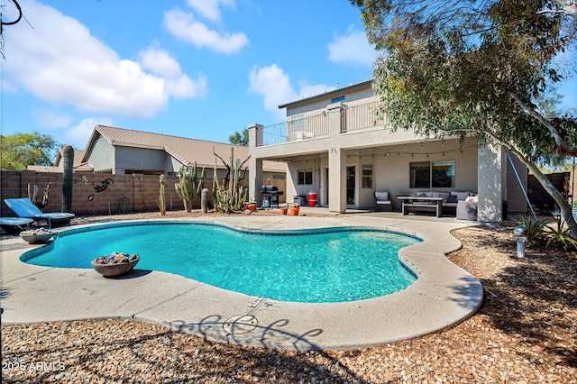 view of swimming pool featuring a fenced in pool, fence, an outdoor hangout area, area for grilling, and a patio