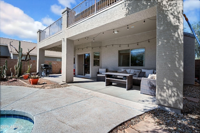 view of patio / terrace featuring outdoor lounge area, a balcony, fence, and grilling area