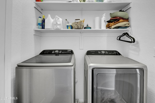 laundry room featuring washer and dryer and laundry area