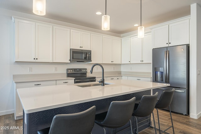 kitchen featuring white cabinets, range with electric stovetop, a sink, and stainless steel fridge with ice dispenser