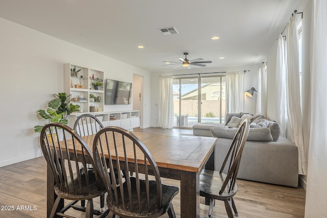 dining space featuring visible vents, baseboards, ceiling fan, light wood-style floors, and recessed lighting