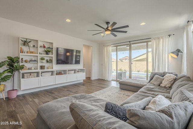 living area with dark wood-style floors, recessed lighting, and ceiling fan