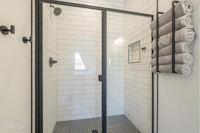 bathroom featuring a shower stall