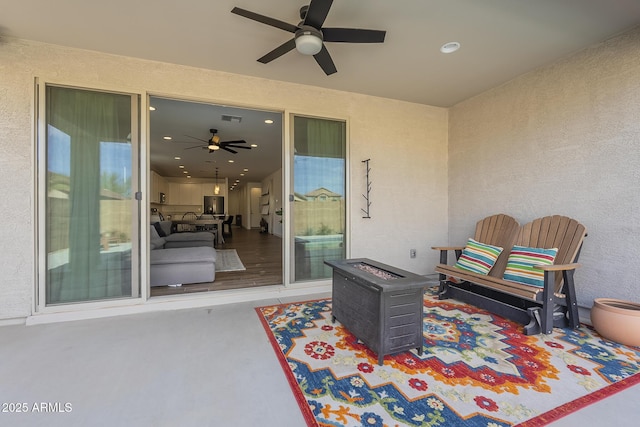 view of patio with a ceiling fan