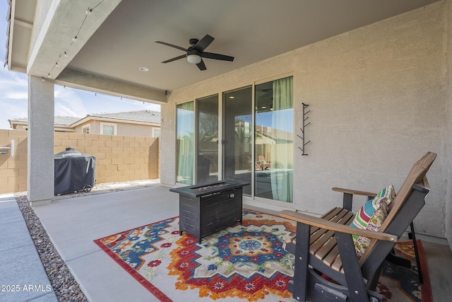 view of patio / terrace featuring grilling area, fence, and a ceiling fan