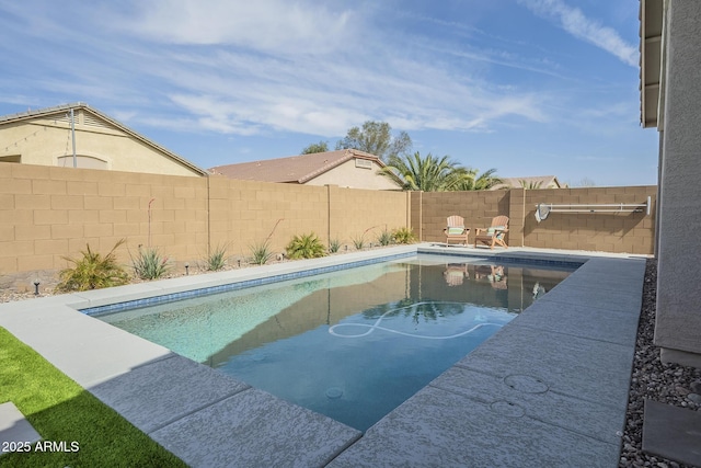 view of swimming pool featuring a fenced backyard and a fenced in pool