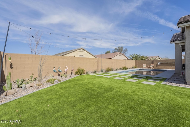 view of yard with a fenced backyard and a fenced in pool