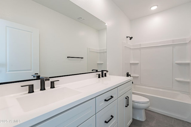 full bathroom featuring  shower combination, a sink, toilet, and double vanity