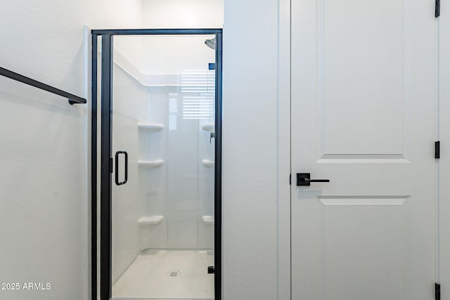 bathroom featuring a shower stall