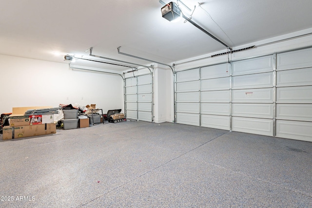 garage featuring a garage door opener