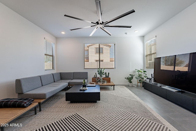 living area with ceiling fan, recessed lighting, and baseboards