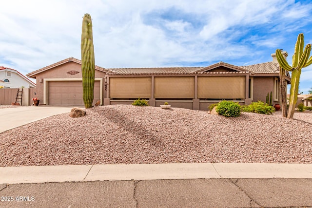 16249 E Stancrest Dr, Fountain Hills, AZ 85268 - view of front of home featuring concrete driveway, a tiled roof, an attached garage, and stucco siding