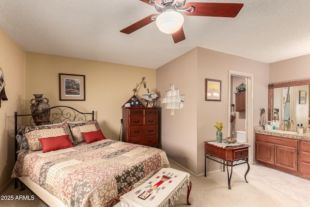 16249 E Stancrest Dr, Fountain Hills, AZ 85268 - bedroom featuring light colored carpet, a sink, baseboards, ceiling fan, and a textured ceiling