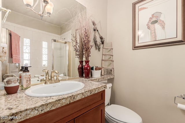 16249 E Stancrest Dr, Fountain Hills, AZ 85268 - bathroom featuring a stall shower, toilet, vanity, a chandelier, and crown molding