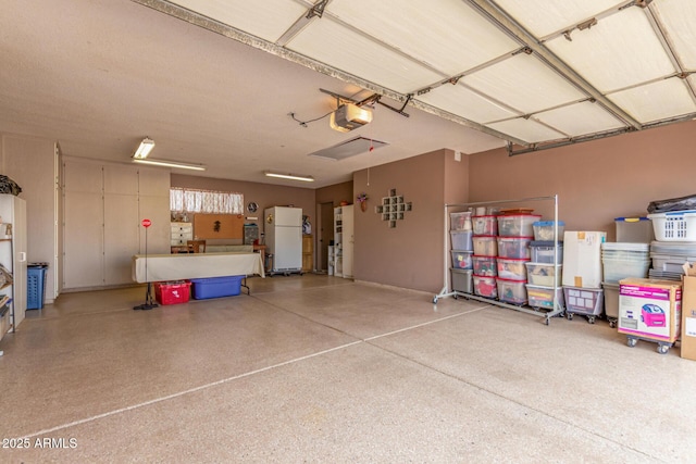 16249 E Stancrest Dr, Fountain Hills, AZ 85268 - garage with freestanding refrigerator and a garage door opener