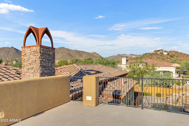 view of patio / terrace featuring a mountain view