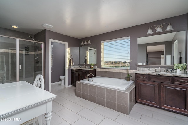 full bath featuring toilet, a stall shower, vanity, and a bath