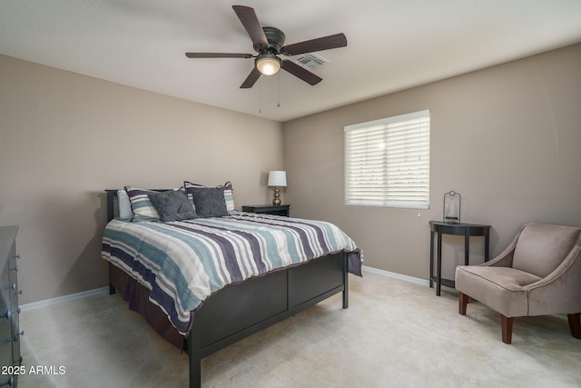 bedroom featuring a ceiling fan, light carpet, visible vents, and baseboards